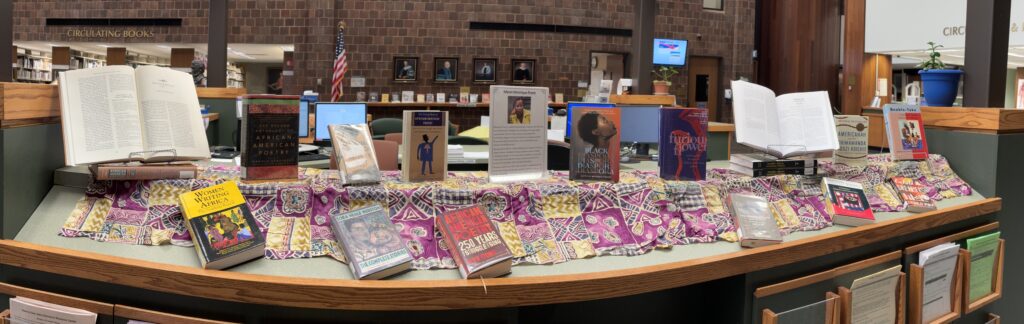 book display in library featuring African American writers, including a new book and profile in the center edited by a GCC staff member, Monique Franz