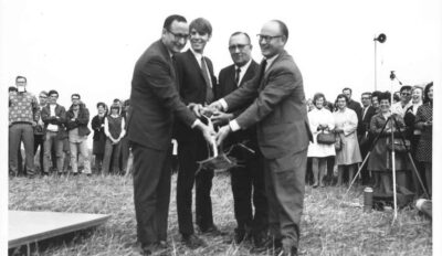 groundbreaking ceremony image of four men with shovel